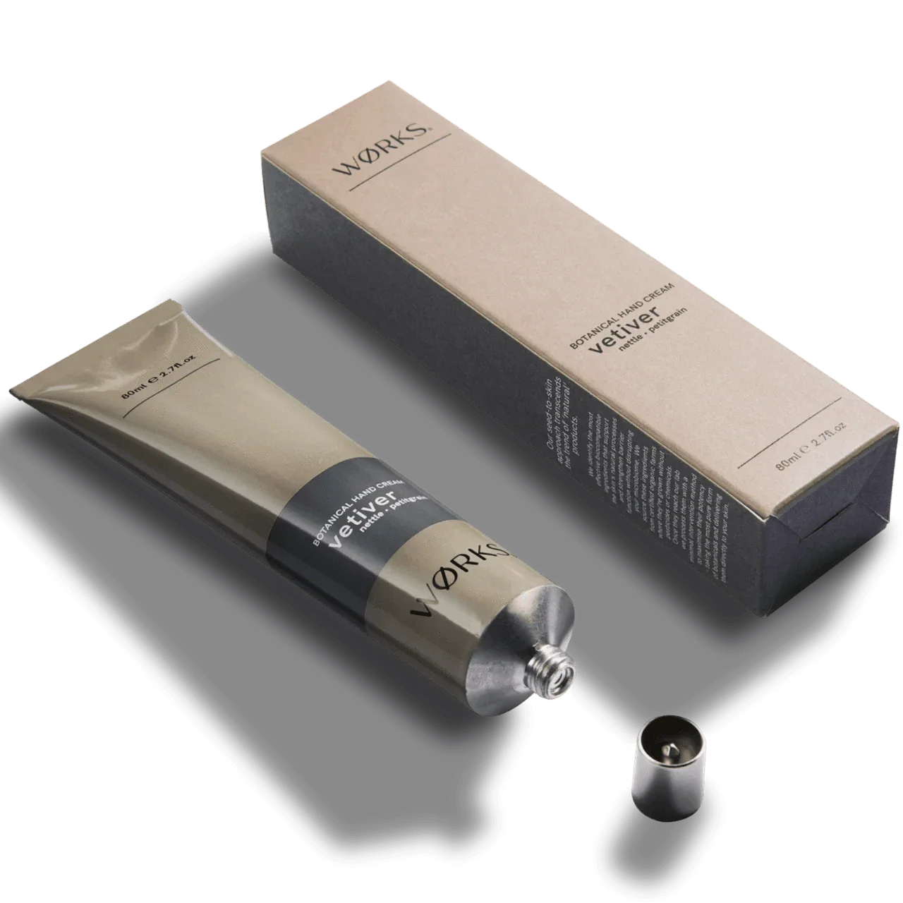 Works Hand Cream tube in aluminium packaging with vetiver scent, featuring plastic-free design and natural moisturizing ingredients.