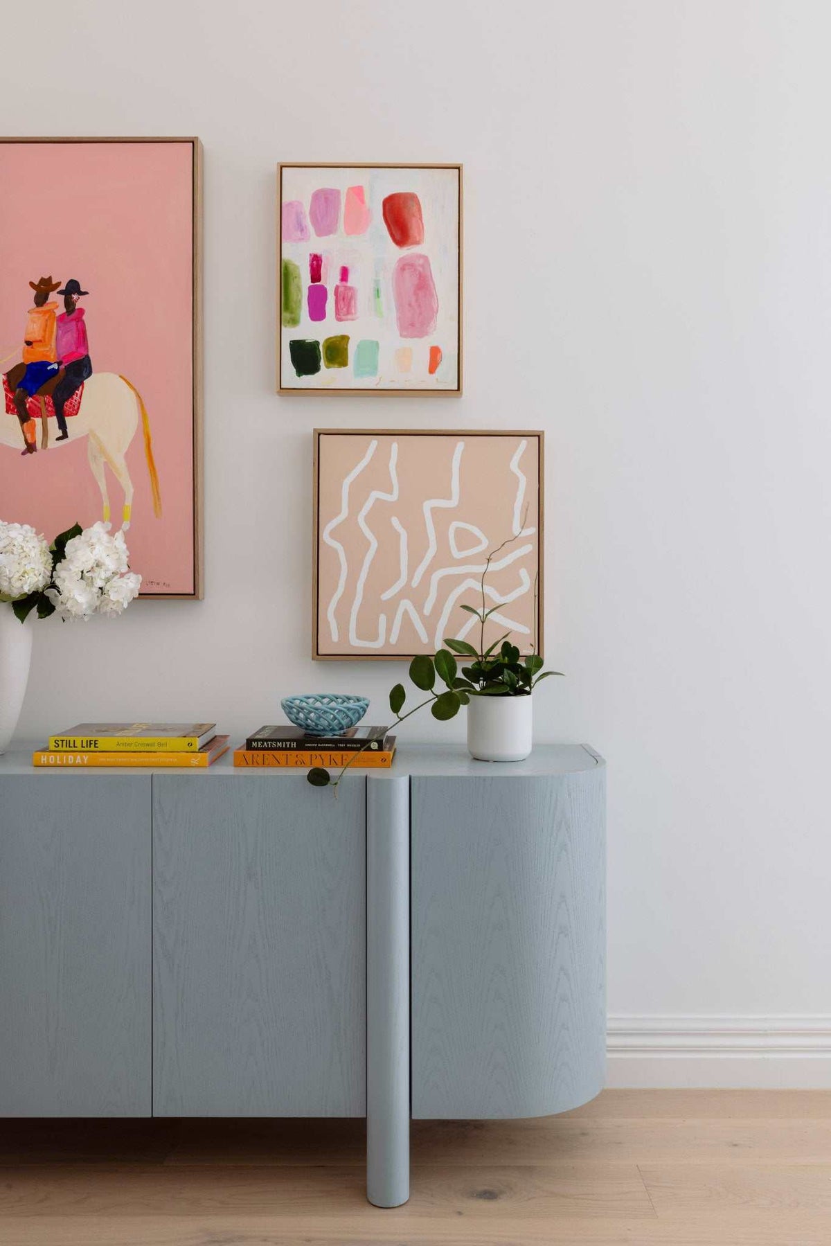 Virtual styling service showing art packages with room photo upload and personalized design recommendations