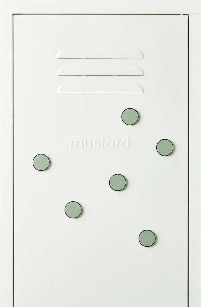 Set of six sage green Mustard Made The Buttons magnets with smooth flat surface on a white magnetic board
