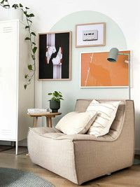 Dark beige Ethnicraft Sofa N701 single-seater in modern living room setting