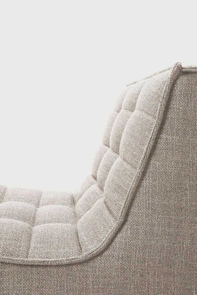 Close-up of a dark beige Ethnicraft Sofa N701 1-seater with tufted upholstery and textured fabric.