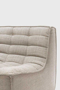 Close-up of Ethnicraft Sofa N701 dark beige fabric with tufted cushion detailing