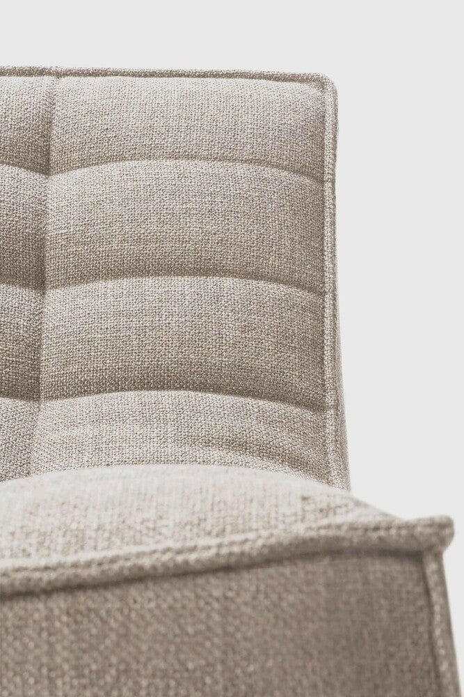 Close-up view of the dark beige Ethnicraft Sofa N701 upholstery with textured fabric and stitched detailing