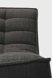 Close-up of dark grey Ethnicraft Sofa N701 1 seater upholstery showing textured fabric and cushioned backrest detail