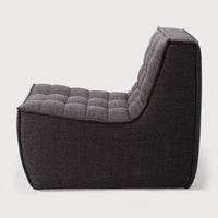 Dark grey Ethnicraft Sofa N701 single-seater with tufted upholstery and compact hardwood frame design