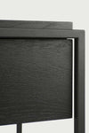 Close-up of Ethnicraft Monolit Console drawer with black oak wood grain and lacquered metal frame.