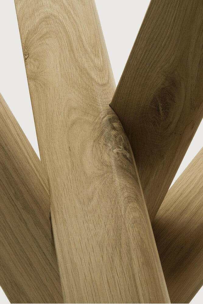Close-up of Ethnicraft Oak Mikado Side Table's solid oak wood with visible grain and intersecting legs design