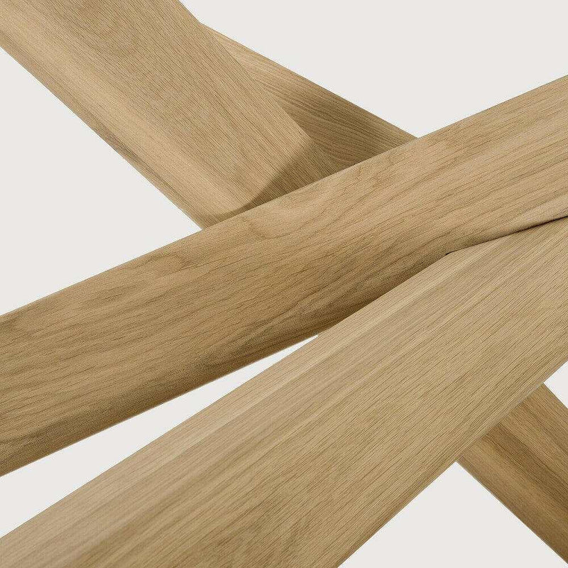 Close-up of intersecting solid oak wood beams from Ethnicraft Oak Mikado round coffee table with hardwax oil finish