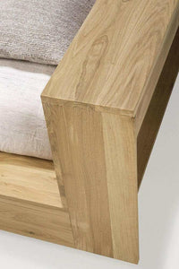 Close-up of Ethnicraft Madra Bed corner made from natural oak wood with a modern, solid design