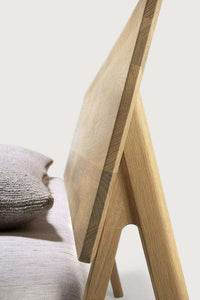 Close-up side view of Ethnicraft Air Bed made from natural solid European oak with angled headboard support