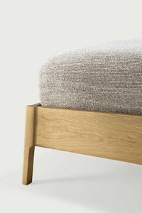 Close-up of Ethnicraft Air Bed corner showing natural oak frame and textured beige mattress upholstery