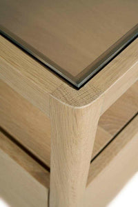Close-up of Ethnicraft Spindle Bedside Table corner showing natural oak wood grain and smokey glass top