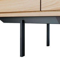 Close-up of Ethnicraft Oak Shadow Sideboard leg and natural oak wood detail with black metal frame.