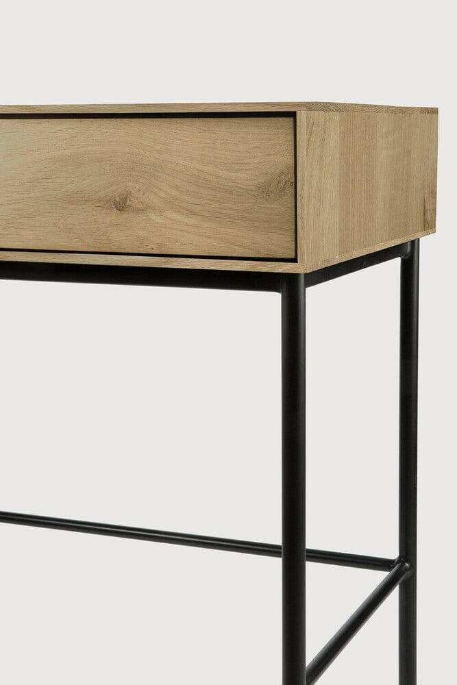 Ethnicraft Whitebird Console in natural oak with black metal legs and two soft-close drawers, designed as a minimalist desk or console table.