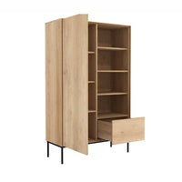 Ethnicraft Whitebird Storage Unit in natural oak with multiple shelves and one drawer on black metal legs