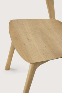 Minimalist Ethnicraft Bok Dining Chair in natural oak with sculptural wooden seat and legs
