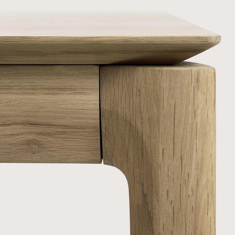 Close-up of Ethnicraft Bok Extendable Dining Table corner in natural oak showing solid European oak wood grain and craftsmanship