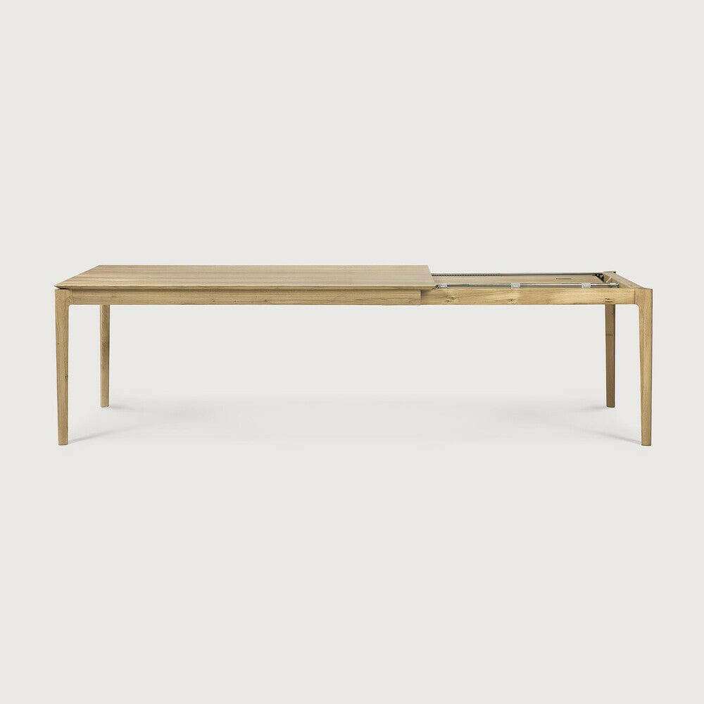 Ethnicraft Bok Extendable Dining Table made of natural oak with a sleek, minimalist design and extendable feature.