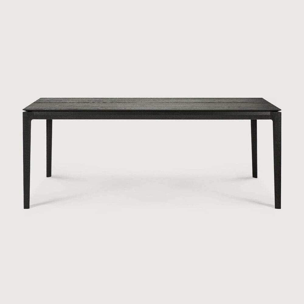 Black Ethnicraft Bok Dining Table made of solid European oak with a sleek, minimalist design.