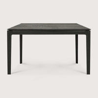Black Ethnicraft Bok Dining Table made of solid European oak with a sleek, modern design and thin, solid construction