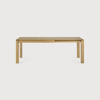 Ethnicraft Slice extendable dining table made of natural oak with clean, minimalist design.