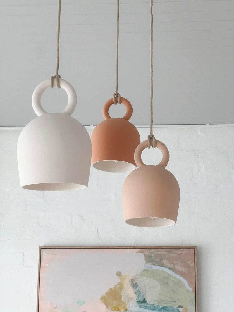 POTT Lighting Calo Pendant handmade white, salmon, and terracotta ceramic bell-shaped hanging lamps with natural jute rope