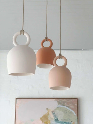 POTT Lighting Calo Pendant handmade white, salmon, and terracotta ceramic bell-shaped hanging lamps with natural jute rope