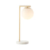 Remi Desk Lamp with antique brass finish, white marble base, and frosted glass shade in Mid-Century Modern style