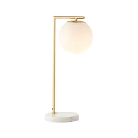 Remi Desk Lamp with antique brass finish, white marble base, and frosted glass shade in Mid-Century Modern style