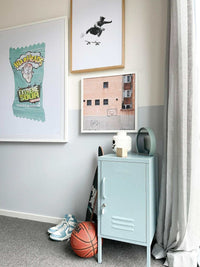 Dom Gauci Kids Art Print Sour Power displayed in a child's bedroom with framed art and sports items nearby