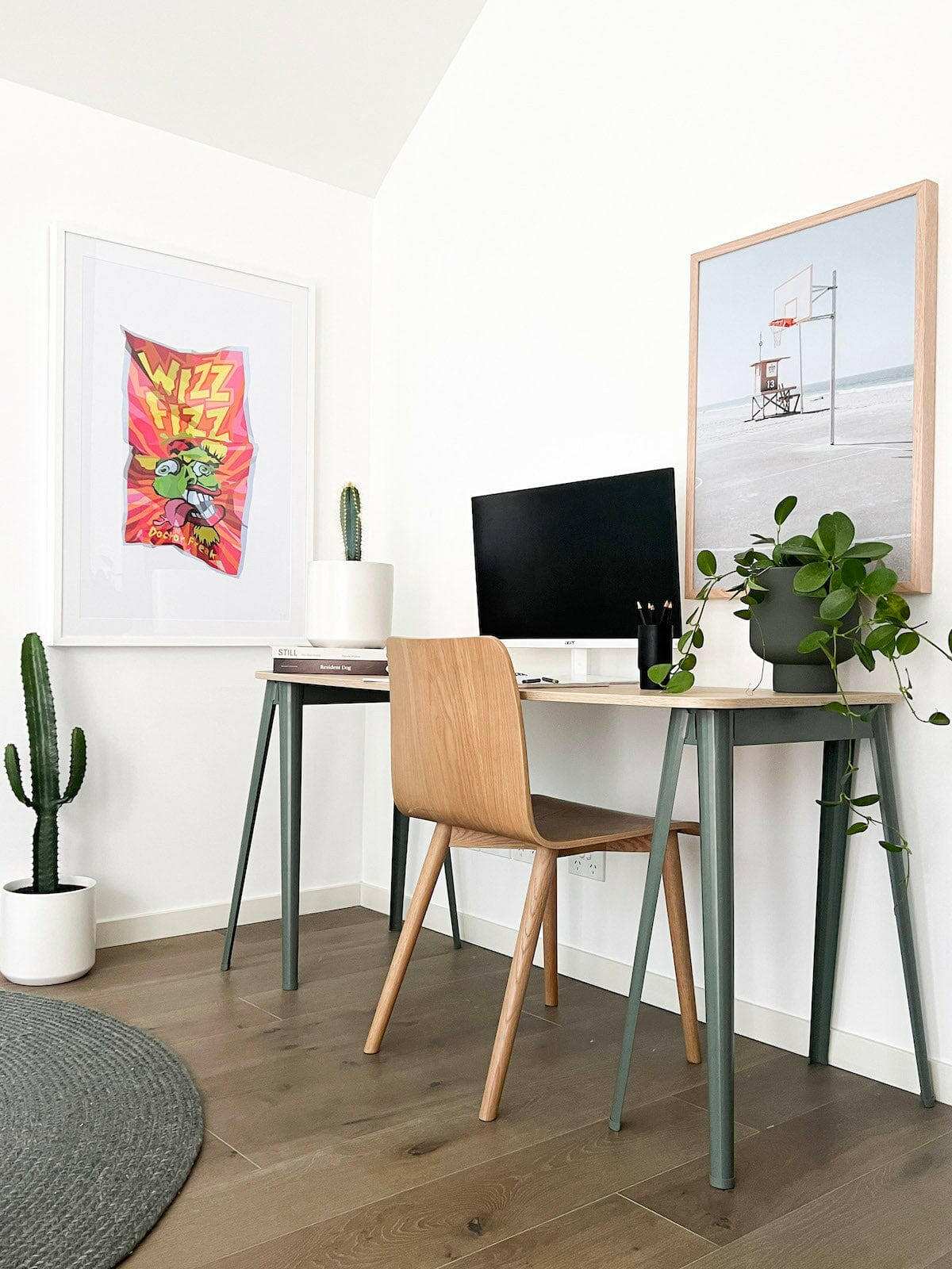 Modern home office with Newport Hoops Print framed basketball wall art and a wooden desk setup