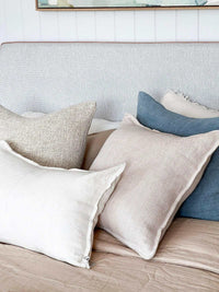 Baya Flaxmill Cushion in nude linen on sofa, natural textured fabric, 50x50cm, organic summer decor