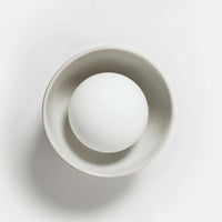 Robert Gordon Bowl Sconce Light ceramic wall light with halogen globe in white, compact design