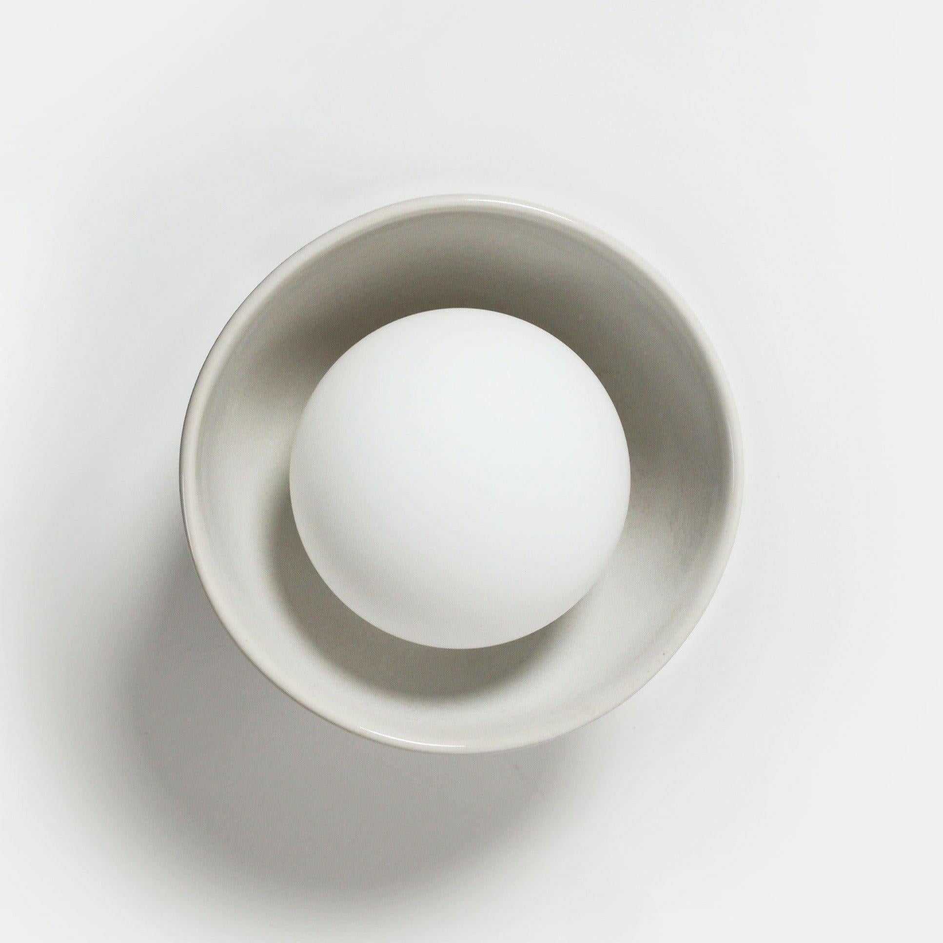 Robert Gordon Bowl Sconce Light ceramic wall light with halogen globe in white, compact design