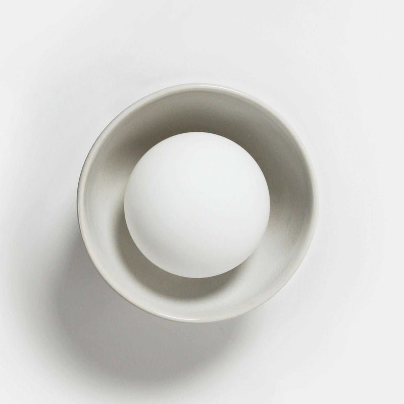 Robert Gordon Bowl Sconce Light ceramic wall light with halogen globe in white, compact design