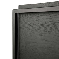 Close-up of Ethnicraft Oak Monolit black stained solid oak sideboard door with varnished finish and black metal frame detailing