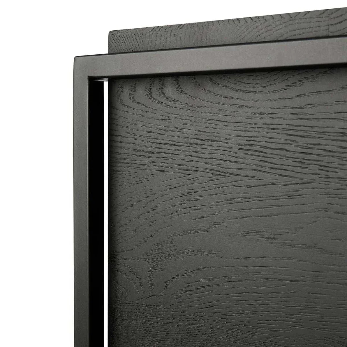 Close-up of Ethnicraft Oak Monolit black stained solid oak sideboard door with varnished finish and black metal frame detailing
