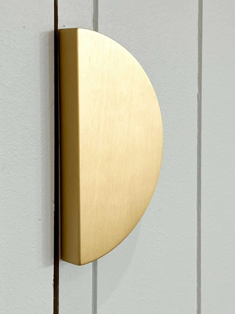 norsu Studio solid brass half moon handle on grey cabinet door