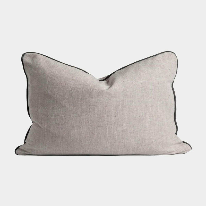 Handmade norsu cushion from the norsu cushion collection with Lexus Haze fabric and charcoal leather piping, made in Melbourne.