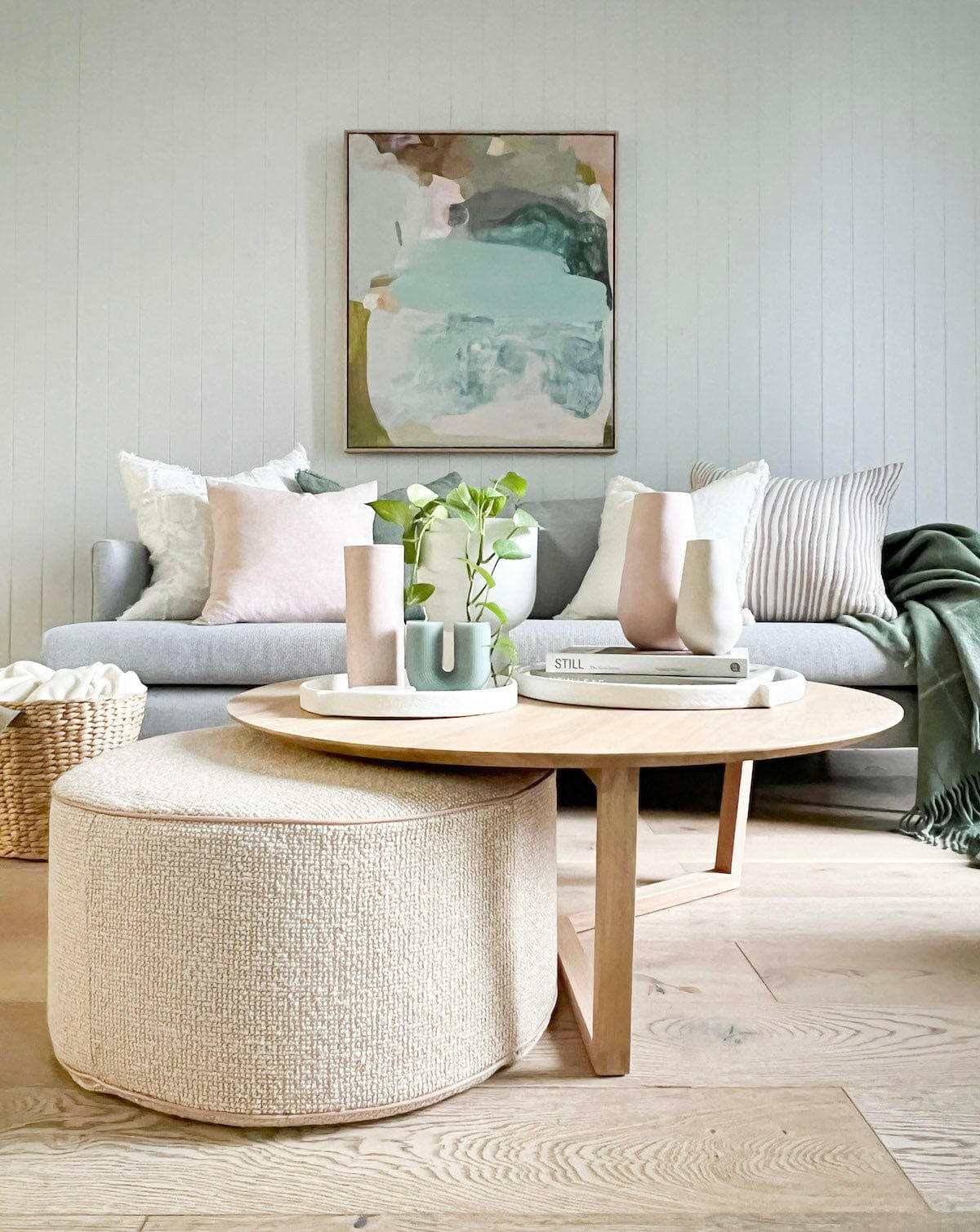 Ethnicraft Tripod Coffee Table in natural oak with solid European oak tripod legs in a modern living room setting