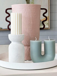 Black Blaze candles Curl Curl sculptural plant-based wax candles on decorative tray