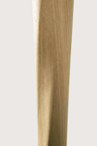 Close-up of Ethnicraft Oak Torsion dining table leg in varnished natural oak wood finish