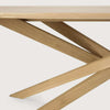 Close-up of Ethnicraft Mikado dining table leg in natural oak with inward flowing, interlocking solid oak design