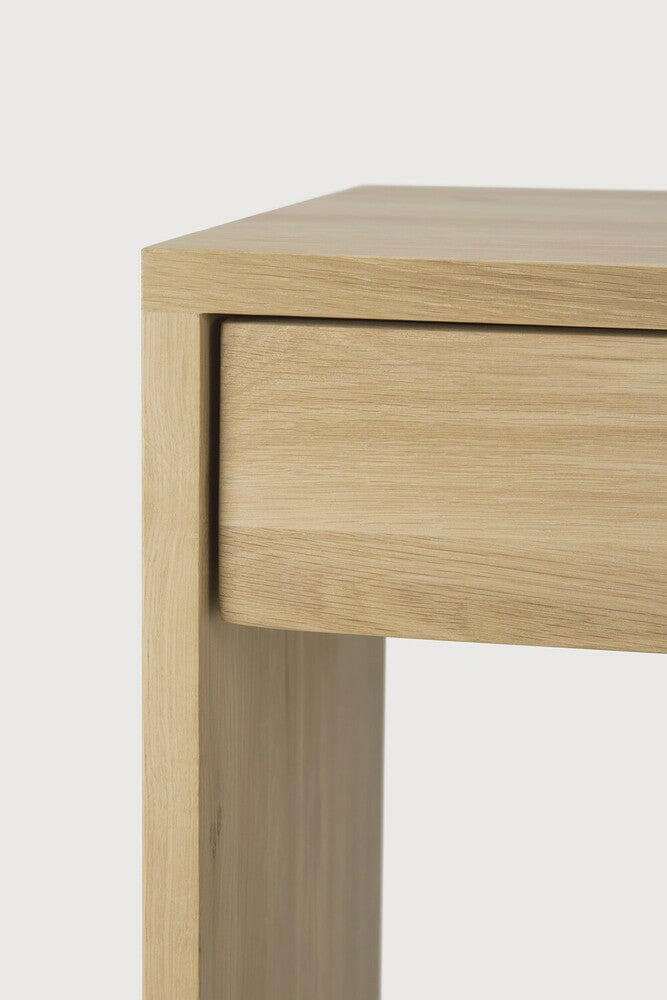 Close-up of Ethnicraft Wave Desk made of natural solid oak with one drawer and smooth contours