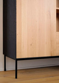 Ethnicraft Blackbird Storage Cupboard in natural oak with black metal legs, made from solid European oak timber.