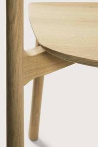 Close-up of Ethnicraft Bok Dining Chair made from natural oak wood showing smooth craftsmanship and elegant design details.