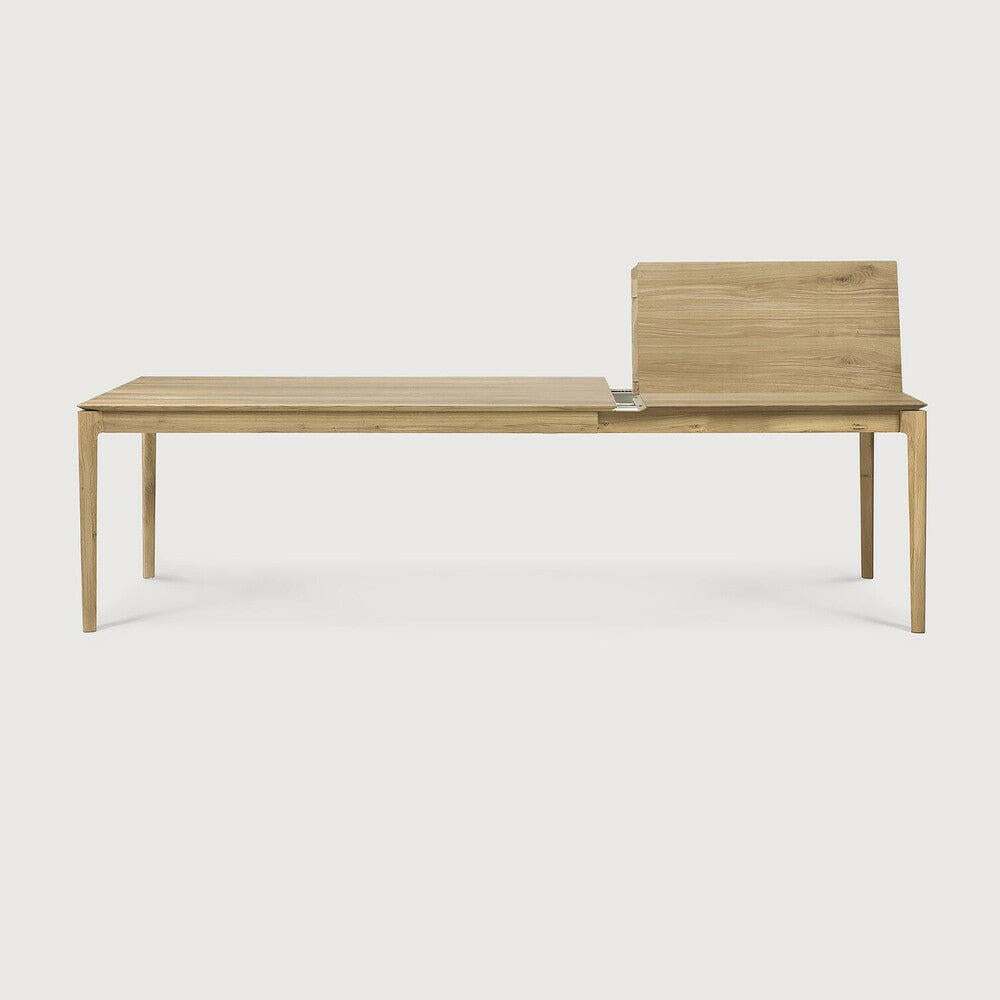 Ethnicraft Bok extendable dining table in natural oak with a sleek, minimalist design and solid European oak construction.