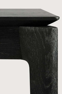 Close-up of black oak Ethnicraft Bok Dining Table corner showing wood grain and sleek design