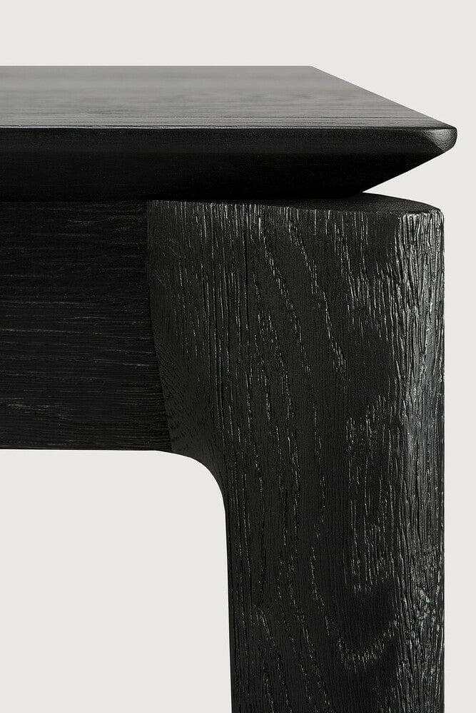 Close-up of black oak Ethnicraft Bok Dining Table corner showing wood grain and sleek design