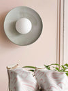 Robert Gordon Dish Wall Sconce ceramic light fixture with hand-glazed dish and LED globe mounted on wall